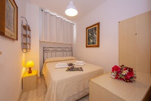 Bedroom with double bed and wardrobe