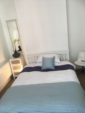 ground floor - bedroom 1 - a double room with bay windows and settee