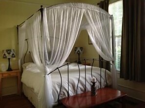 Queen size bed with adjoining bathroom downstairs