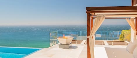 Patio with outdoor bed and ocean view -1