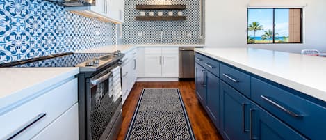 Kitchen with Italian tiles and wood open shelves, quartz countertops