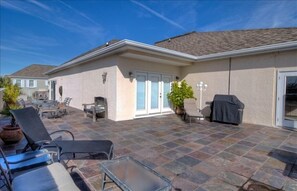 Huge deck with multiple seating and lounging areas.