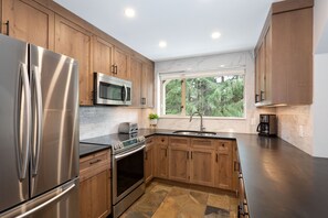 Stylish kitchen with stainless steel appliances and plenty of counter space