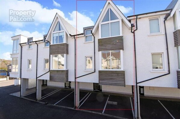 The front of the property with two covered carparking spaces.