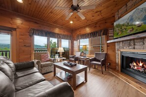 Living room with fireplace and flat screen TV