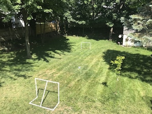 Large rear yard with room to play. Basketball hoop in driveway.