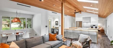 Ultra Modern Living area with Dining and Kitchen in the background.