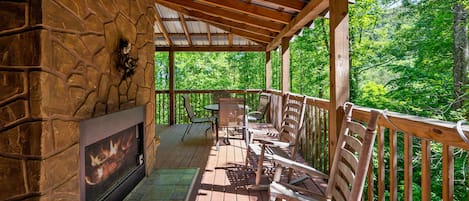 Enjoy the outdoor views under this spacious covered deck with comfy furniture.