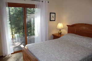 Master bedroom with walk out porch and view of the water.