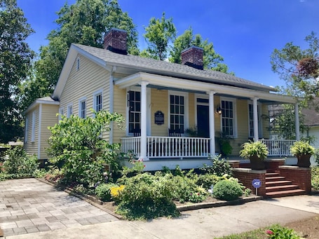 Front of home with a great front porch with rocking chairs and swing