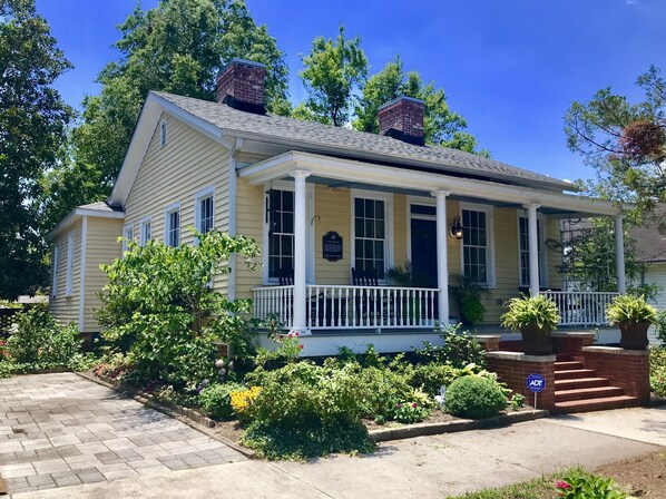 Front of home with a great front porch with rocking chairs and swing