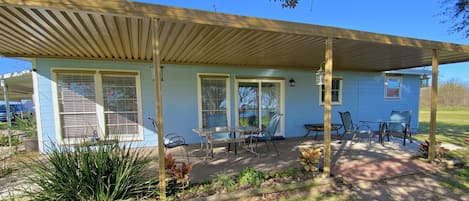 South facing covered porch with view of Caney Creek. Always breezy and cool!