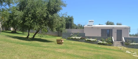 View of the garden and entrance of the apartment