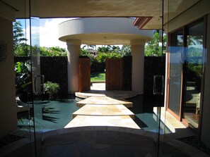 Entry - "Floating" stones over circular entry pond.