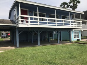 Upper deck and breezeway below offer plenty of covered area for entertaining 