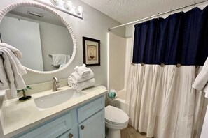 The hall Bathroom includes a shower/tub combo and startup supply of soap and essentials.