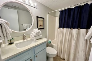 The hall Bathroom includes a shower/tub combo and startup supply of soap and essentials.