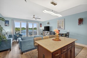 open living area grab a quick breakfast kitchen island that includes 3 barchairs