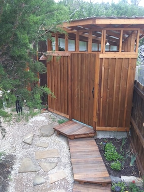shower house in private back yard with hot H2O rain shower and composting toilet