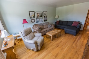 Brown couch is also a sofa bed