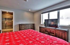 King bed and smart TV in the master bedroom.