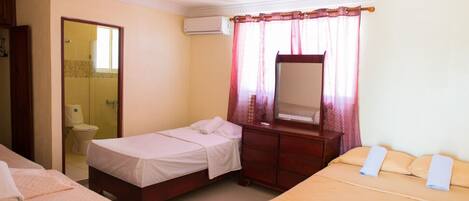 Air conditioned One bedroom apartment with 3 single beds and 1 double large bed