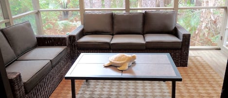 Screened porch with new couch and love seat - comfy place to enjoy your coffee