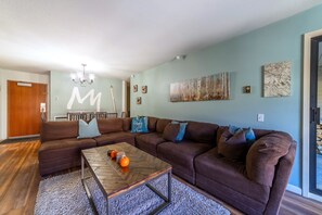 Living room has large comfortable sofa.