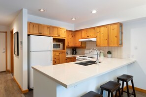 Open concept kitchen with breakfast bar