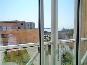 Balcony overlooking the sea and the residence parking lot.