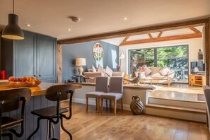 Heath Cottage, Mattishall, Norfolk: Ground floor: Large open-plan kitchen with stairs leading to the sofa area and garden
