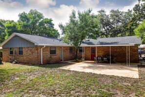 Rear has doors to bathroom and garage