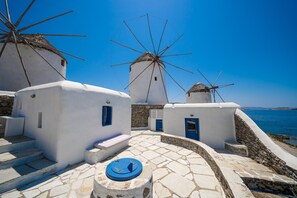 A patio among the Mykonos Windmills, just for you!