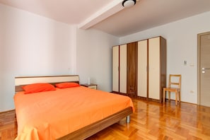 Bedroom 1: One double bed and wardrobe.