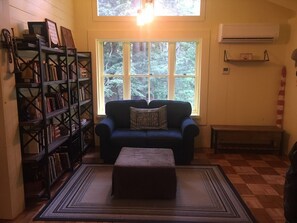 Entry & reading nook; ottomans open for more seating. Great spot for reading!