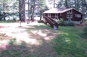 View from the driveway. Room for cars and boats. 
Ramp for easy access. 