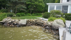 Beautiful stone stairs and railing to access sandy bottom water!