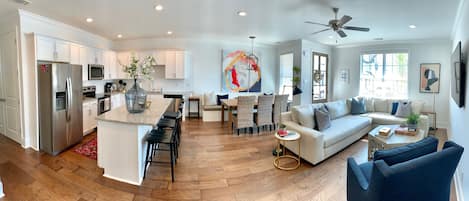 Living room and kitchen.  Can see TV from kitchen.