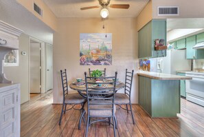 Dining area next to galley kitchen.