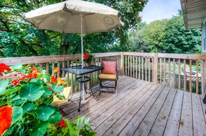 BALCONY - The  balcony is covered with the canopy of large tree and outdoor furniture.
