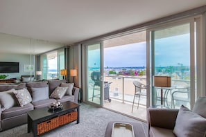 Sliding glass doors off of living room open to private balcony