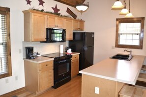 Kitchen area has a Kitchen Island where guests 