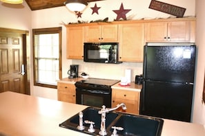 This cabin has a fully equipped kitchen appliances for guests convenience