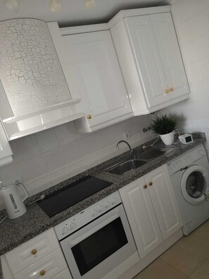 modern kitchen with all mod cons and washing machine 