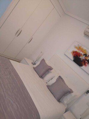 spacious main bedroom with air con and ensuite