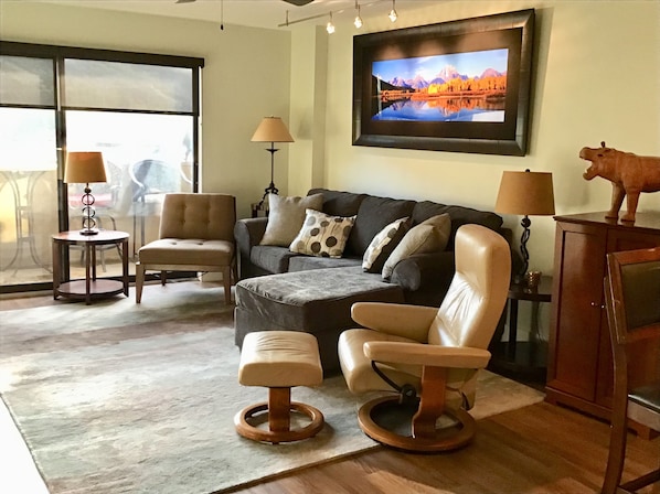 Relax by the fire in the living room with a great ski mountain view.