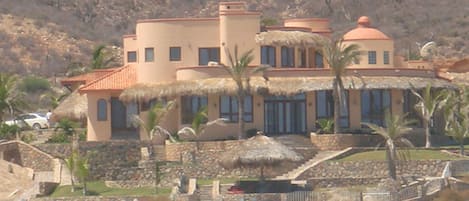 Main house on the beach. Guesthouse is behind at the level of the car on left