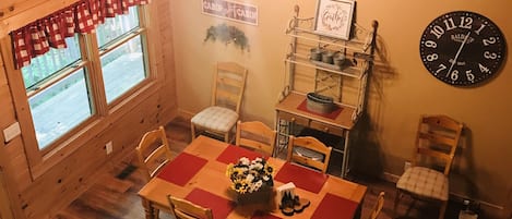 Lovely dining room open to the family room that seats eight.