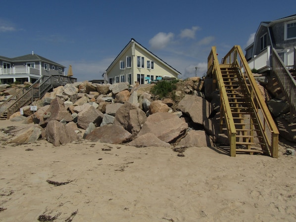 view from the private beach looking up to the house and access stairs