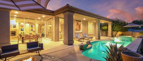 Luxurious backyard with a private pool and plenty of lounge space to relax and connect.